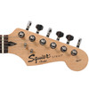 Close-up of the headstock front on a used Squier Affinity Strat electric guitar showing the Squier by Fender logo and tuning machines. card