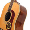 Close-up of the upper body and soundhole on the used 1992 Washburn D-25S/N acoustic guitar showing the rosette and tortoiseshell pickguard. card