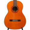 Close front view of Aria A-20 classical guitar body with natural top, decorative rosette, dark bridge, and nylon strings. card