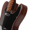 Close-up of the upper body and neck joint on the Fender Rosewood Telecaster showing the grain, black pickguard, and neck pickup. card