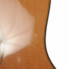 Close-up of a small finish impression on the upper bout of the Western red cedar top on the R. Taylor Style 1 guitar. card