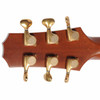 Rear view of the R. Taylor headstock showing the gold tuning machines. card