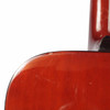 Close-up of cosmetic finish wear and light surface scratches near the neck joint on the back of the guitar body.