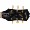 Front close-up of the black Epiphone Les Paul headstock with Standard truss rod cover, Les Paul Model script, and six vintage-style tuning keys. card