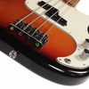 Close-up of the bridge and split-coil pickup on the 2022 Fender Player Precision Bass in 3-Color Sunburst finish. card