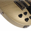 Close-up of the lower body on a used 2023 Gibson Les Paul Modern electric guitar in Light Gold Mist showing the finish, bridge, control knobs, and output jack. card