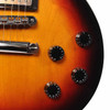 Close-up of the lower body controls on a 2009 Gibson Les Paul Studio in Fireburst featuring the bridge and control knobs. card