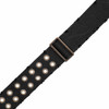 Close-up of the adjustable antique brass slider on a Levy's black cotton guitar strap with decorative eyelets. card