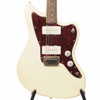 Front close-up of Squier Paranormal Jazzmaster XII 12-string electric guitar in Olympic White with tortoiseshell pickguard, dual soapbar pickups, and adjustable bridge. card