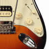 Close-up of the controls, pickup selector, tremolo bridge, and output jack on a Fender American Professional Stratocaster HSS electric guitar. card