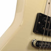 Close-up of scratches and finish wear near the neck pickup. card