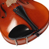 Close-up of the Etude 2008 4/4 violin ebony tailpiece, chinrest, and bridge. card