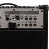 Close-up of the rear connectivity panel featuring included Bluetooth adapter, speaker output, balanced XLR output, USB, effects loop, foot control, headphones/record out, and auxiliary input. card
