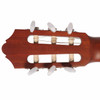Rear headstock view of the Yamaha CGX122MC-NT showing the slotted wood construction, nylon-string rollers, and white tuning buttons. card