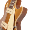 Close-up of the upper bout and cutaway on the used 2025 Gibson Les Paul Standard '50s P-90 showing the Gold Top finish and cream pickguard. card