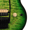 Close-up of the Matcha Green quilt top showing the cream volume knob, three-way selector switch, bridge pickup, and double-locking tremolo. card
