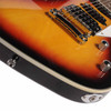 Close-up of sunburst body, chrome bridge and tailpiece, output jack, and control knobs; light scratches and small marks are visible on the finish near the bridge and controls. card