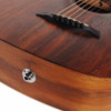 Close-up of Taylor acoustic-electric guitar bridge, black bridge pins, saddle, and output jack. card