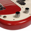 Close-up of chrome control knobs, output jack, white pickguard, and red body showing scratches, scuffs, and a small dark mark. card