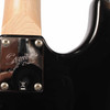 Rear neck-joint close-up showing Squier neck plate and visible scratches in the black body finish. card