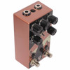 Angled view of Walrus Audio Monument V2 showing control knobs, top-mounted jacks, mode toggle, and copper-colored enclosure. card