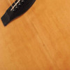 Close-up of Yamaha FG-502 natural top showing a long repaired or stabilized crack extending from near the bridge toward the lower body. card