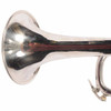 Close-up of the silver trumpet bell showing visible scratches and surface wear. card