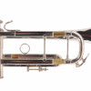 Close-up of the trumpet tuning slides and braces showing areas of worn silver plating and exposed brass. card