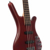 Angled front view showing the contoured burgundy red body, four-string fingerboard, dual MEC pickups, and chrome hardware. card