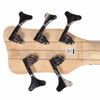 Rear headstock close-up showing the natural wood construction, five Warwick tuning machines, RockBass branding, and serial markings. card