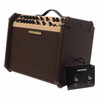 Angled view of Fishman Loudbox Artist amplifier with included Fishman dual footswitch positioned beside the cabinet. card