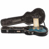 Eastman Romeo LA resting inside its open fitted black hardshell case with certificate of authenticity. card