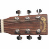 Close-up of Martin LX1 headstock face with gold Martin logo and six chrome tuning machines. card