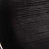 Close-up of the figured black top showing a small light-colored scratch. card