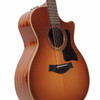 Angled front view showing the Honeyburst top, cutaway body, wood binding, dark pickguard, and glossy wood sides. card