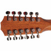 Rear headstock close-up showing twelve chrome Taylor tuning machines and natural wood grain. card