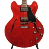 Close-up front view of a cherry Gibson ES-345 semi-hollow electric guitar with dual humbuckers, black pickguard, four control knobs, and dual f-holes. card