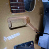 Interior pickup cavity showing routed body wood, wiring, mounting holes, and underside of hardware. card