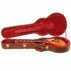 Gibson Les Paul resting inside open brown hardshell case with red plush interior. card