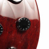 Close-up of the front body near a control knob showing light scratches, small marks, and finish wear. card