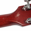 Close-up of the rear headstock and neck joint showing repaired crack and finish wear. card