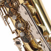 Close-up of pearl key touches and silver-colored keywork on the upper body. card