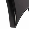 Close-up of black body edge showing scratches and a small finish chip near the pointed end. card
