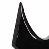 Close-up of pointed black body horn showing small finish chips and surface wear. card
