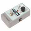 Low-angle view of Freeze pedal showing the silver enclosure, front controls, footswitch, and side input jack. card