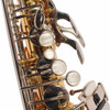 Close-up of upper saxophone keywork, pearl-style keys, and metal levers. card