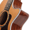 Close-up of cutaway showing white binding, glossy wood-grain sides, and decorative fretboard inlays. card