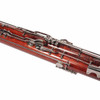 Angled view of bassoon keys, rods, and silver-colored hardware along the lower wooden section. card
