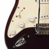 Close-up of volume and tone knobs, five-way selector switch, and chrome output jack plate. card
