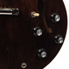 Close-up of four volume and tone knobs, pickup selector switch, and output jack. card